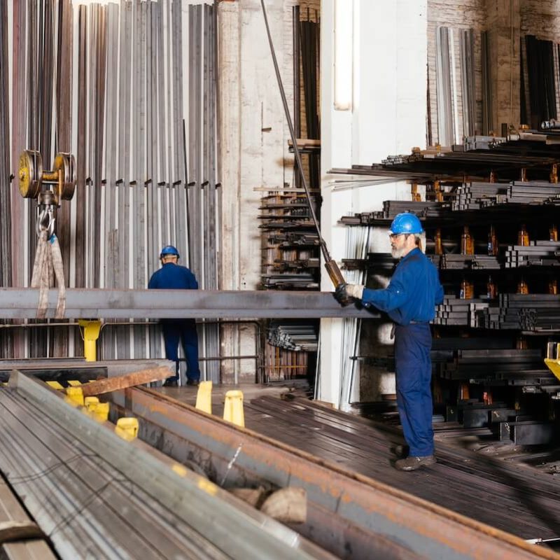 male-workers-in-metal-workshop-using-crane-to-carr-2024-01-23-16-12-19-utc (1)